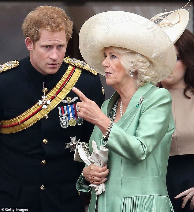 Camilla speaks to Prince Harry at Buckingham Palace during Trooping the Color in June 2015