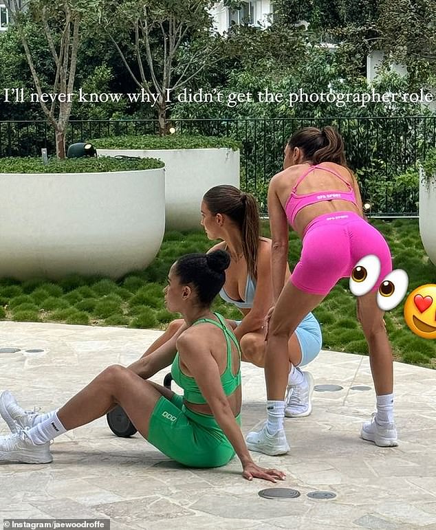 The fitness mogul was leaning out in a pair of very revealing pink activewear during a photoshoot when Jae snapped a photo of her exposed behind.