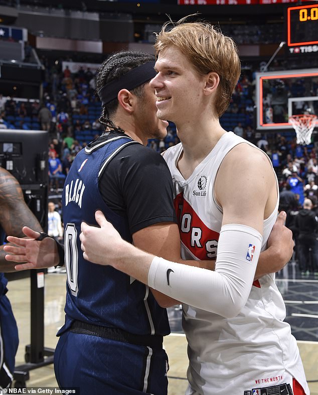 The two kissed before deciding to troll fans and reporters with a jersey swap.