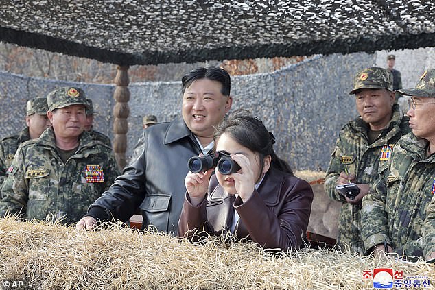 In this photo provided by the North Korean government, North Korean leader Kim Jong Un, center left, and his daughter inspect the training of Korean People's Army airborne units in North Korea on Friday, March 15 2024.