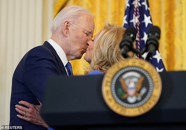 President Joe Biden kisses first lady Jill Biden