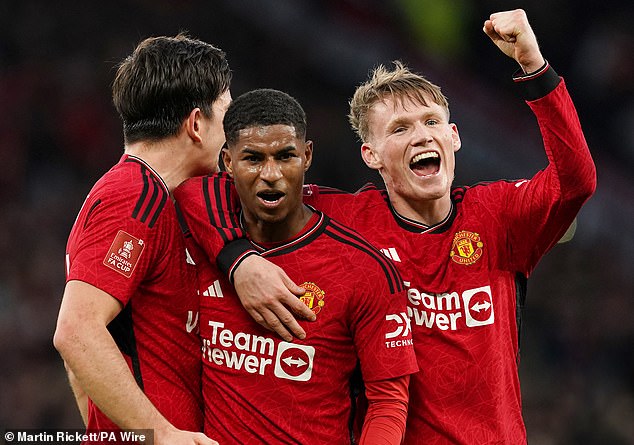 United players celebrate their dramatic 4-3 win over Liverpool in the FA Cup