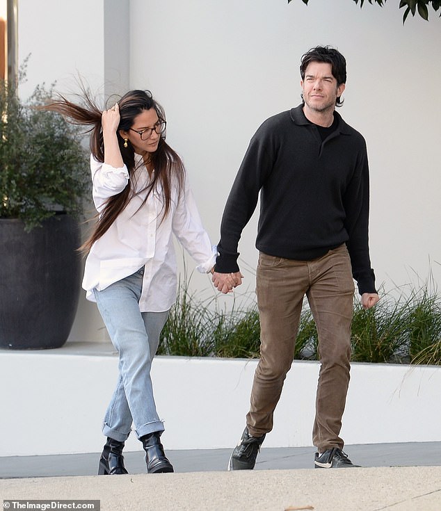 Munn held hands with Mulaney, 41, with whom she shares son Malcolm, two, as they headed to a friend's house in West Hollywood