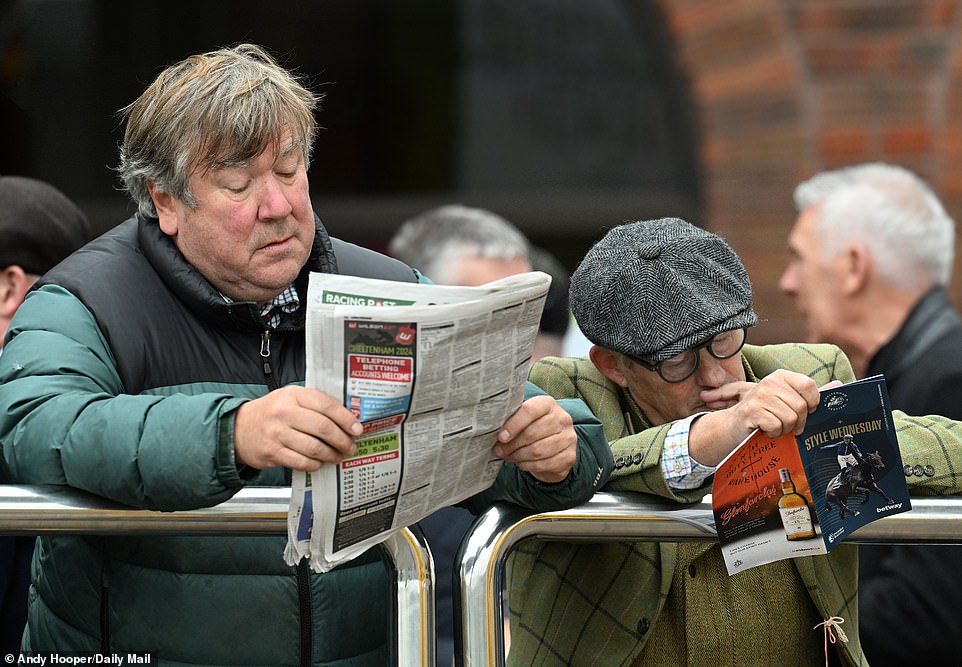 A punter reads the Racing Post one morning, perhaps looking for the best betting tips for the day of action ahead.