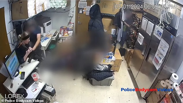 Despite the barrage of bullets, neither he nor the other staff member - seen cowering in fear behind cardboard boxes as the bullets ripped through - were pinned, police said.  State authorities are investigating the incident