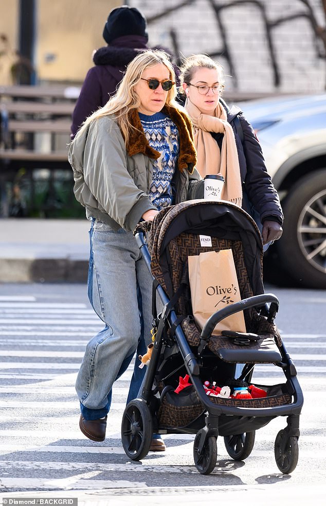 The American Psycho actress, 49, who came under fire in January for complaining that women playing sports and walking their dogs were taking over the city, looked relaxed as she pushed a stroller empty with a companion.