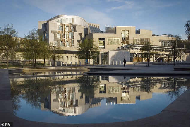 Ms Rowling targeted by campaigners who claim she could be prosecuted under controversial new Hate Crime and Public Order (Scotland) Act (Pictured: Scottish Parliament building in Holyrood)