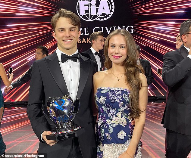Piastri and his girlfriend Lily Zneimer are pictured in Baku as he received the FIA ​​Rookie of the Year trophy last December