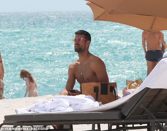 Djokovic, 35, took some vitamin D while soaking up the sun by Miami's still-clear water