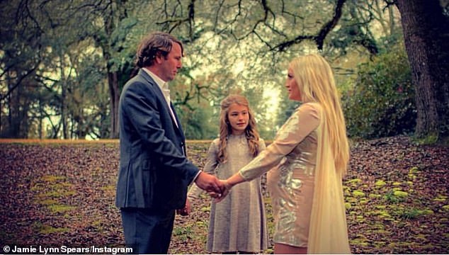 Another sweet snap shows the couple with Spears' daughter Maddie, now 15, from a previous relationship, appearing to officiate at the couple's vow renewal when the All That star was pregnant with daughter Ivey.