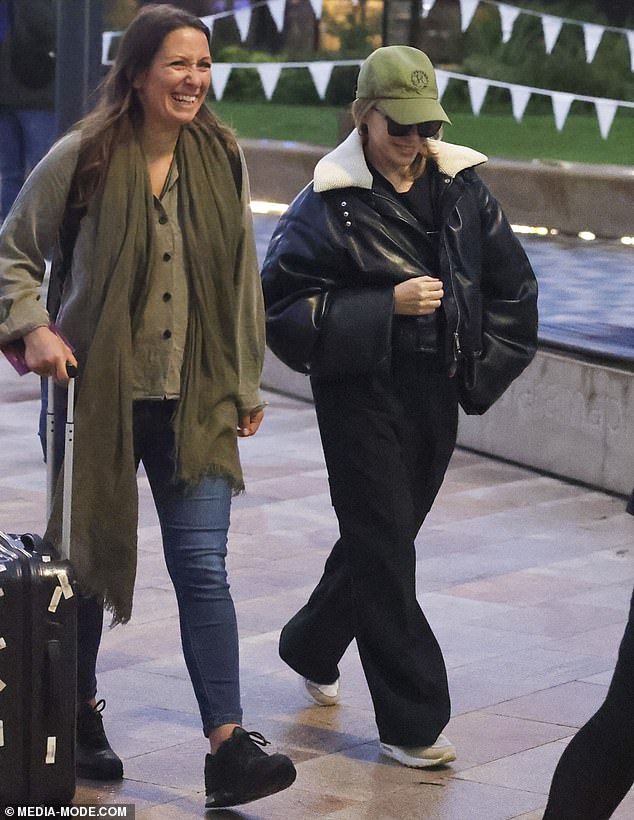 Kylie kept her face hidden behind her cap and dark sunglasses