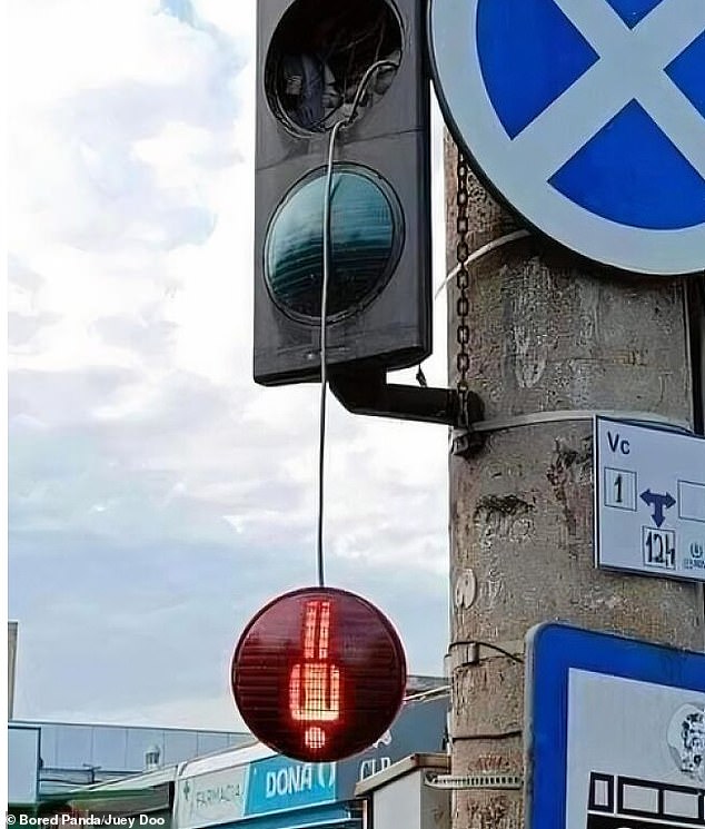 Few people will encounter an upside-down red man traffic signal, much less a red man forced out of a traffic light.