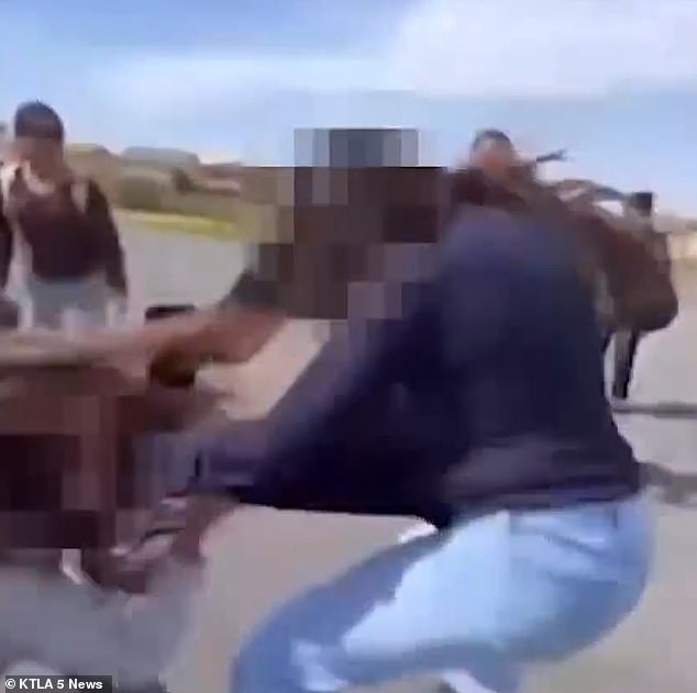 The victim could be seen holding on to the other girl's sweater in an attempt to stop the attack.