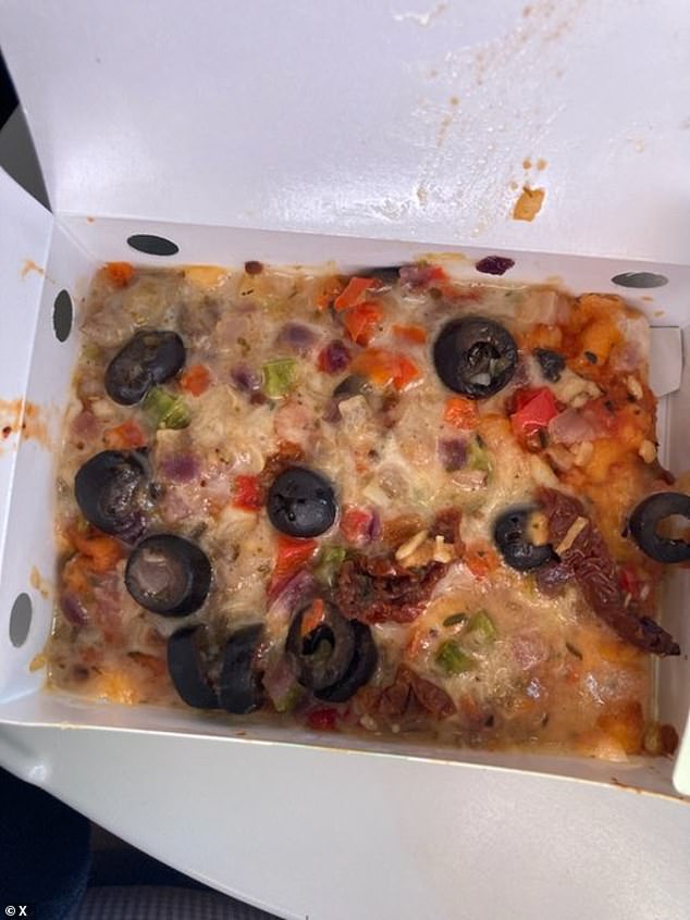 A customer who flew from Sydney to Melbourne shared an image of what was supposed to be pizza but looked more like a pile of regurgitated olives, peppers and cheese (pictured)