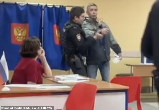 Versions of the story suggest the officer suspected him of spoiling his ballot in protest against Putin.