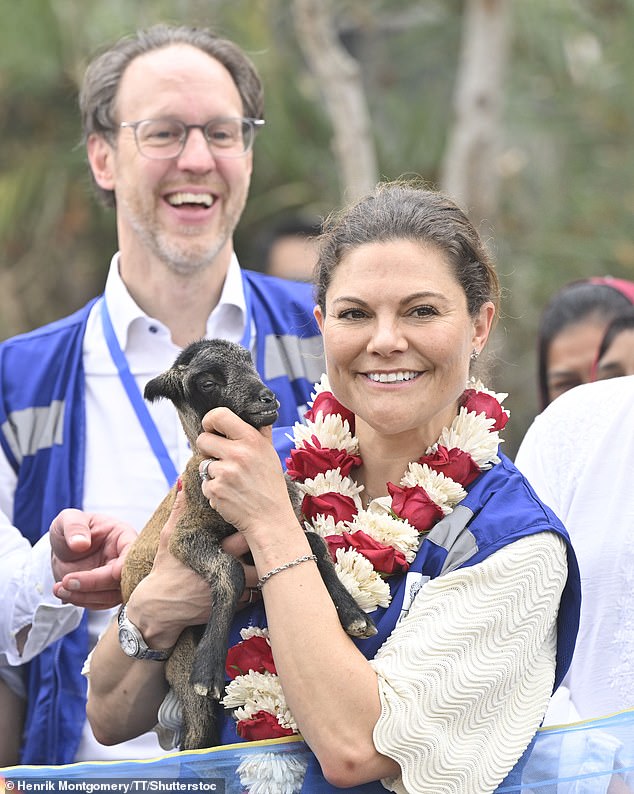 The heir to the Swedish throne beamed as she held a goat during her visit to Bangladesh's climate change project