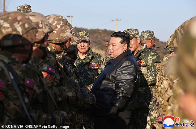 Kim Jong Un is pictured inspecting a major operational training base in the Korean People's Army's western zone earlier this month.