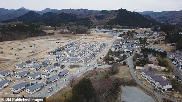 The aerial view shows ongoing public housing construction in Okawara district, where the government lifted a mandatory evacuation order in 2019.