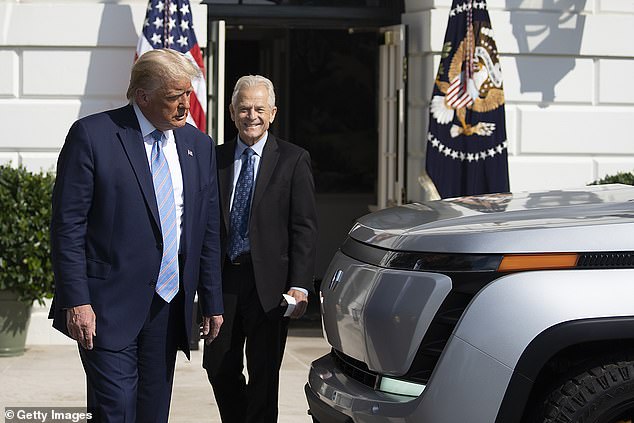 Navarro was President Donald Trump's trade adviser. They are seen together in 2020 examining an all-electric pickup truck on the South Lawn of the White House.