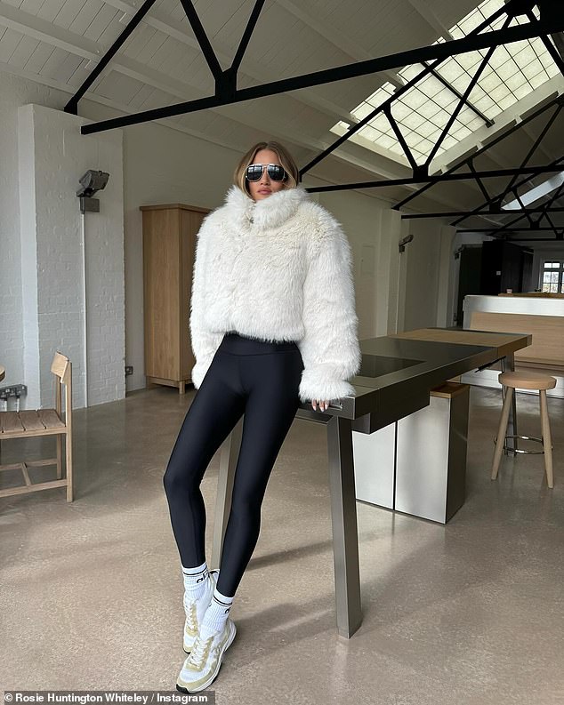 Rosie teamed the garment with a pair of leggings and high-waisted sports socks, while completing her ensemble with a pair of chic Chanel sneakers.