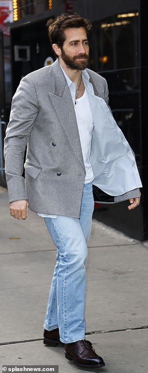 He added even more retro style by pairing the outerwear with a pair of light blue jeans.
