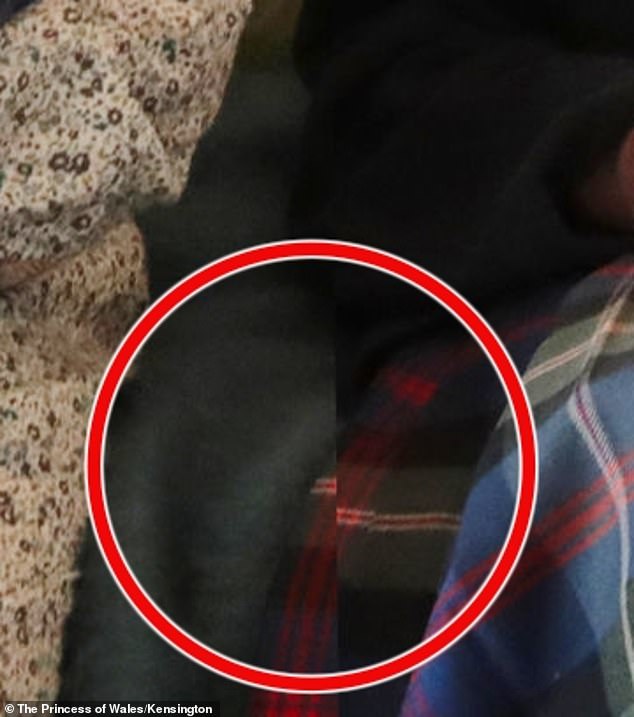 The tartan pattern on the late queen's skirt appears to have been cut off and is out of place.