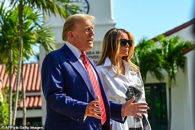 Melania Trump stood alongside the former president as he answered questions. She wore black sunglasses.