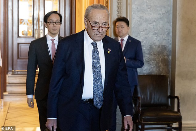 U.S. Senate Majority Leader Chuck Schumer (center) leaves the Senate chamber Thursday after his remarks on Netanyahu's tenure.