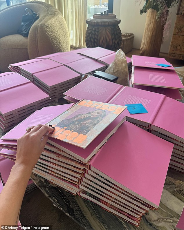 It wasn't all fun and games for the social media star, who revealed she had dozens of copies of her latest cookbook Cravings: All Together that required her signature.