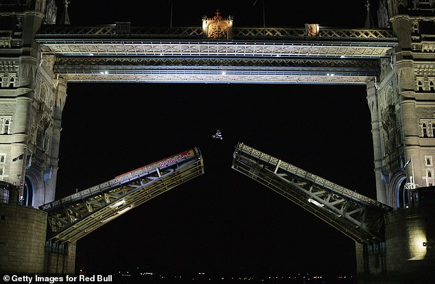 Maddison (pictured jumping London's Tower Bridge) risked his life to perform record-breaking stunts which made him famous around the world.
