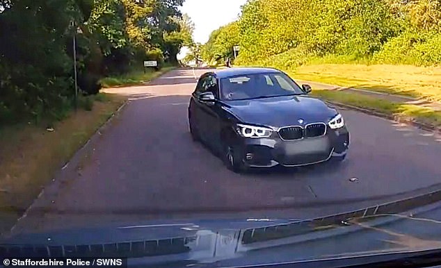 In another clip, a BMW driving at high speed suddenly veers off its side of the road and appears to be heading into a head-on collision.