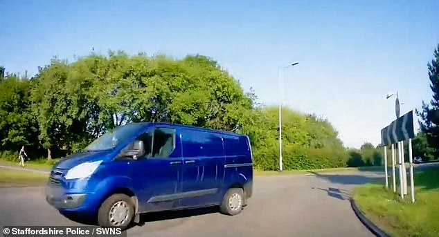 Dashcam video shows a vehicle crossing the roundabout when a large blue van suddenly appears and appears to be heading straight towards it. A panicked gap narrowly avoids a pileup