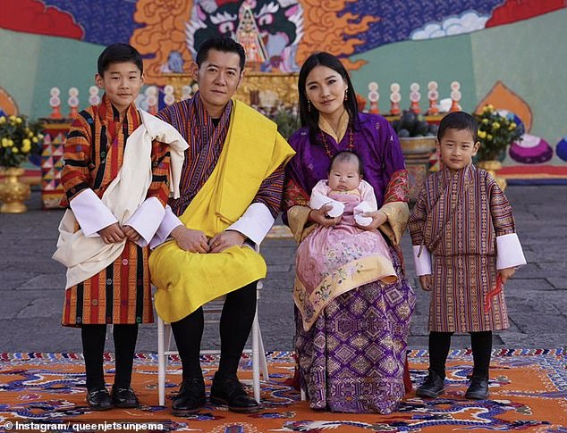 The King (center left) and Queen (center right) of Bhutan have three children, Jigme Namgyel (far left), Jigme Ugyen (far right) and Sonam Yangden (sitting on lap from his mother)