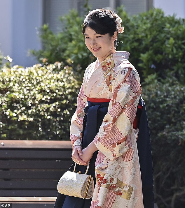 The princess appeared in good spirits as she walked through the university grounds on her way to attend her graduation ceremony in Tokyo's Mejiro district.