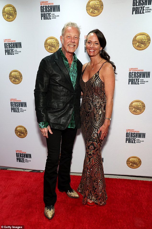 Hetfield walked the red carpet wearing a smart green and black shirt, slightly unbuttoned and without a tie.