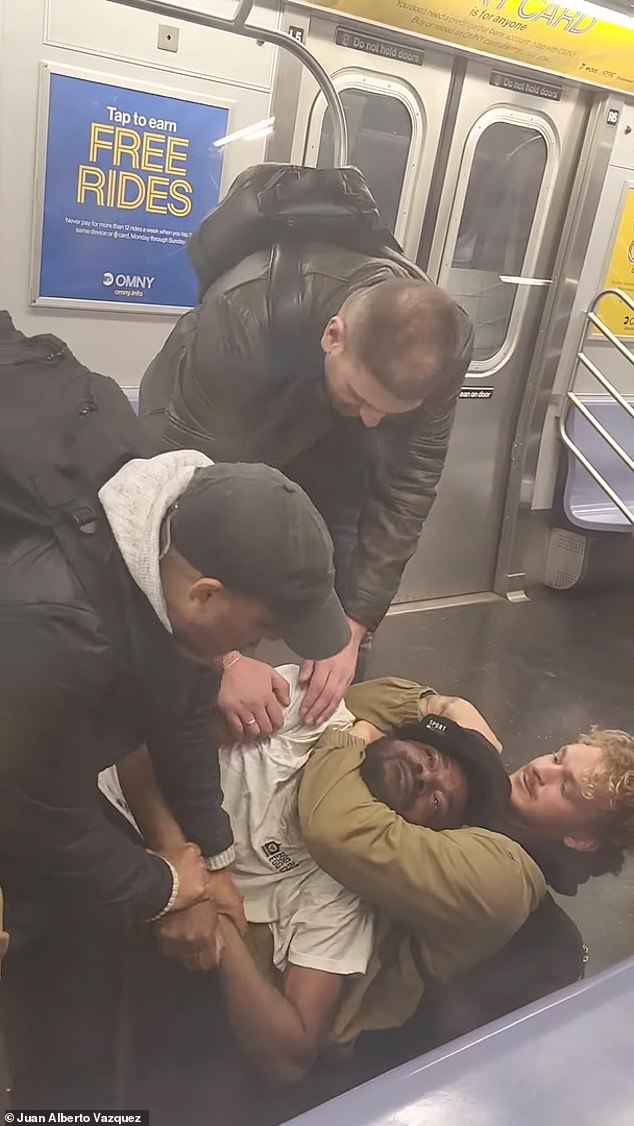 Penny held Neely in a chokehold on the floor of the subway car while others helped her on May 1.