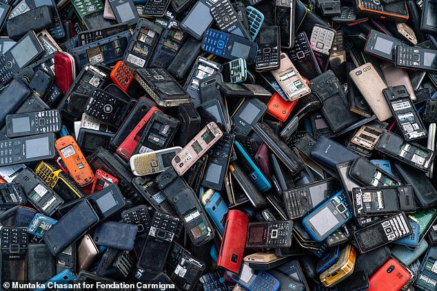 Cell phones and other telecommunications devices accounted for 4.6 million tons of electronic waste worldwide. This image shows phones collected for informal recycling in Ghana.