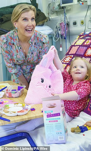 Two-year-old patient Astrid (pictured right) seemed to enjoy her contact with royalty