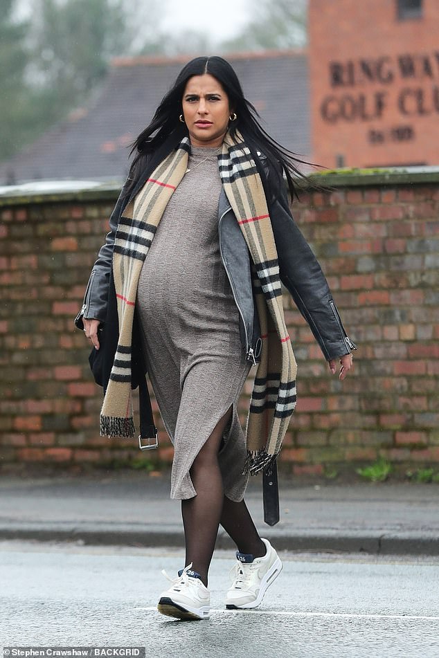 The actress paired the dress with a Burberry scarf and a quilted coat. Sair is expecting her first child with boyfriend Nathan Chilton