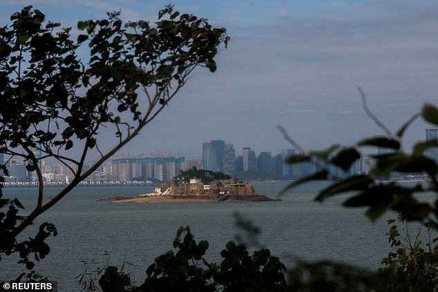 Shiyu or Lion Islet, part of Kinmen County, one of the islands off Taiwan, is visible with Xiamen, China in the background.