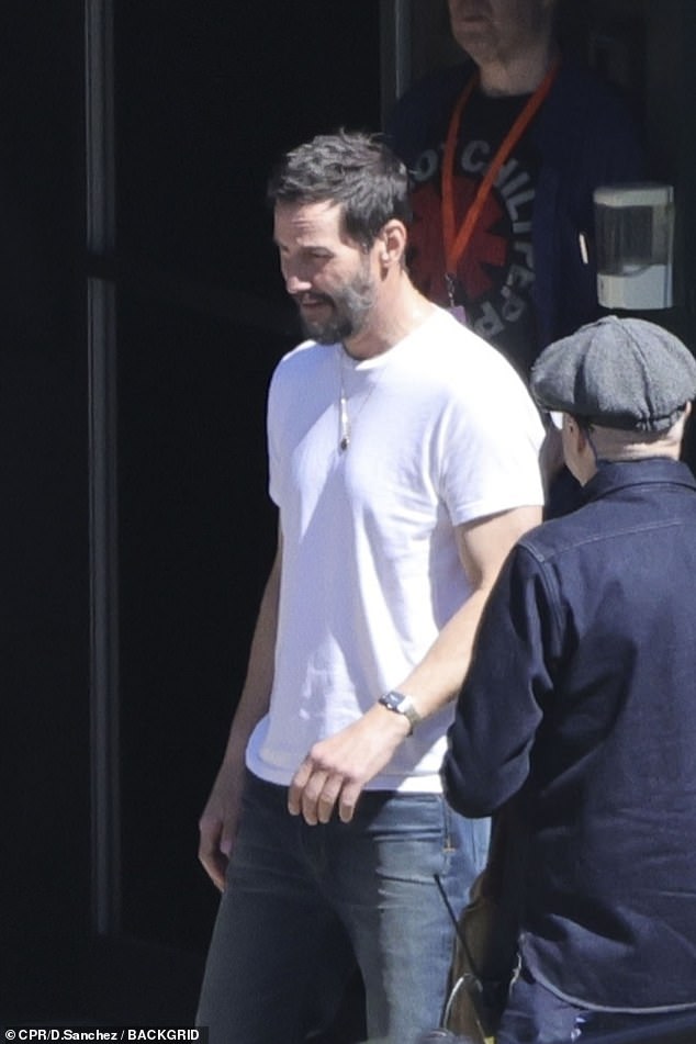 Keanu ditched his jacket at one point to show off his fit torso in a white t-shirt