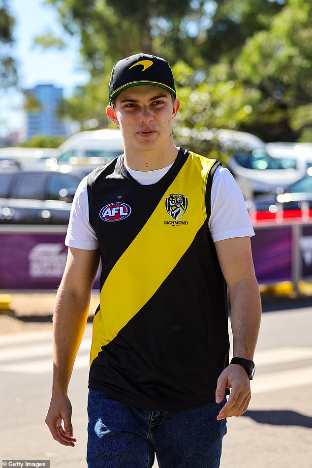 The Melbourne-born McLaren star showed his love for Richmond's AFL team as he arrived at the track where he hopes to make the podium on Sunday.