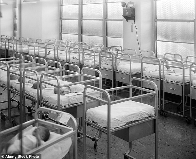 Babies are seen in hospital cribs in the United States in the 1950s