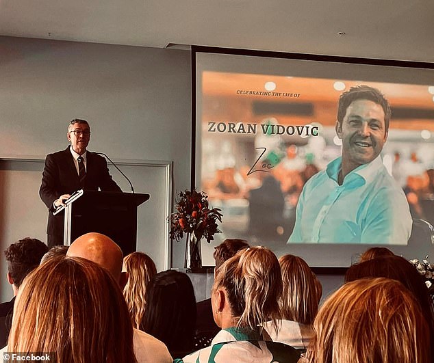 Zagi Kozarov said he was even banned from attending the memorial service (pictured) for Zoran Vidovic, which saw hundreds of mourners fill the GHMBA stadium social hall