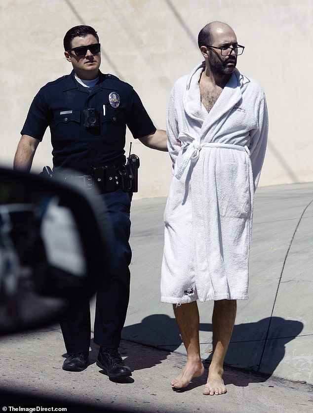 Richard, 45, who married Quinn, 35, in 2019, was seen taken away in handcuffs by police officers while barefoot and wearing only a bathrobe after the incident involving the couple's only child, Christian Georges Dumontet, two years old, Tuesday.