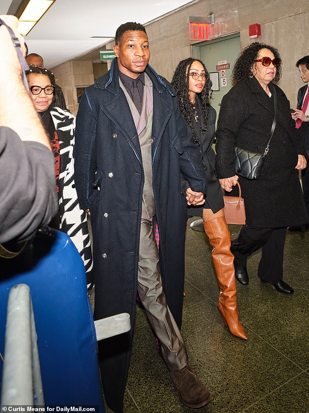Jonathan Majors arriving at the Manhattan courthouse with his girlfriend Meagan Good by his side