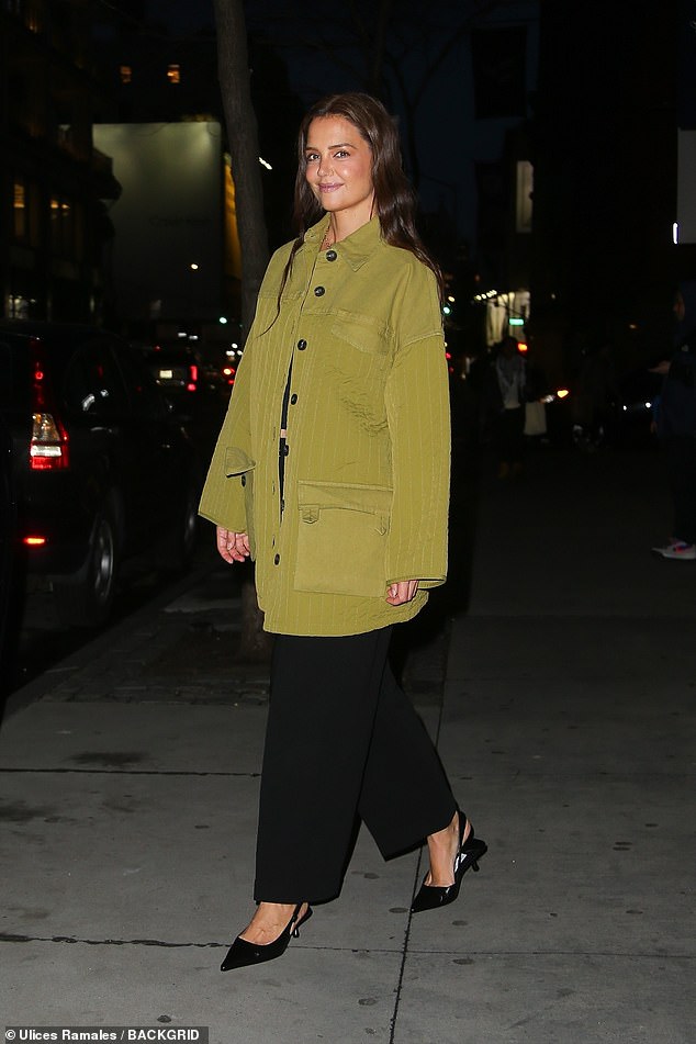 The Dawson's Creek star, 45, was spotted leaving a restaurant in New York's upscale SoHo neighborhood. Holmes wowed in a chic olive green jacket paired with a black crop top and pants