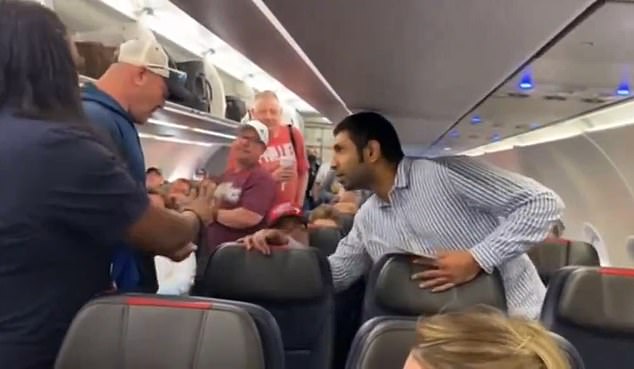 The video of the incident has since gone viral online and was released in three parts. (photo: the moment the other passenger decided to control the unruly man)