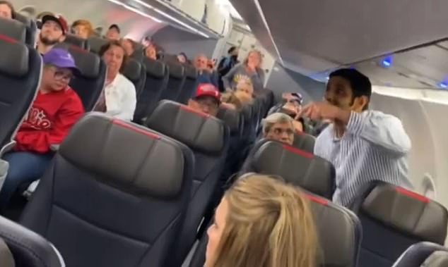 The passenger, dressed in a white and blue striped button-down, caused a huge scene on the flight as he sat on the runway and was delayed for 30 minutes.