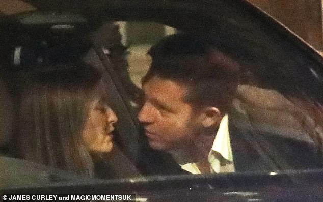 As Holly got into her car to go home, Nick gave her a steamy kiss after their romantic dinner at the luxury restaurant.